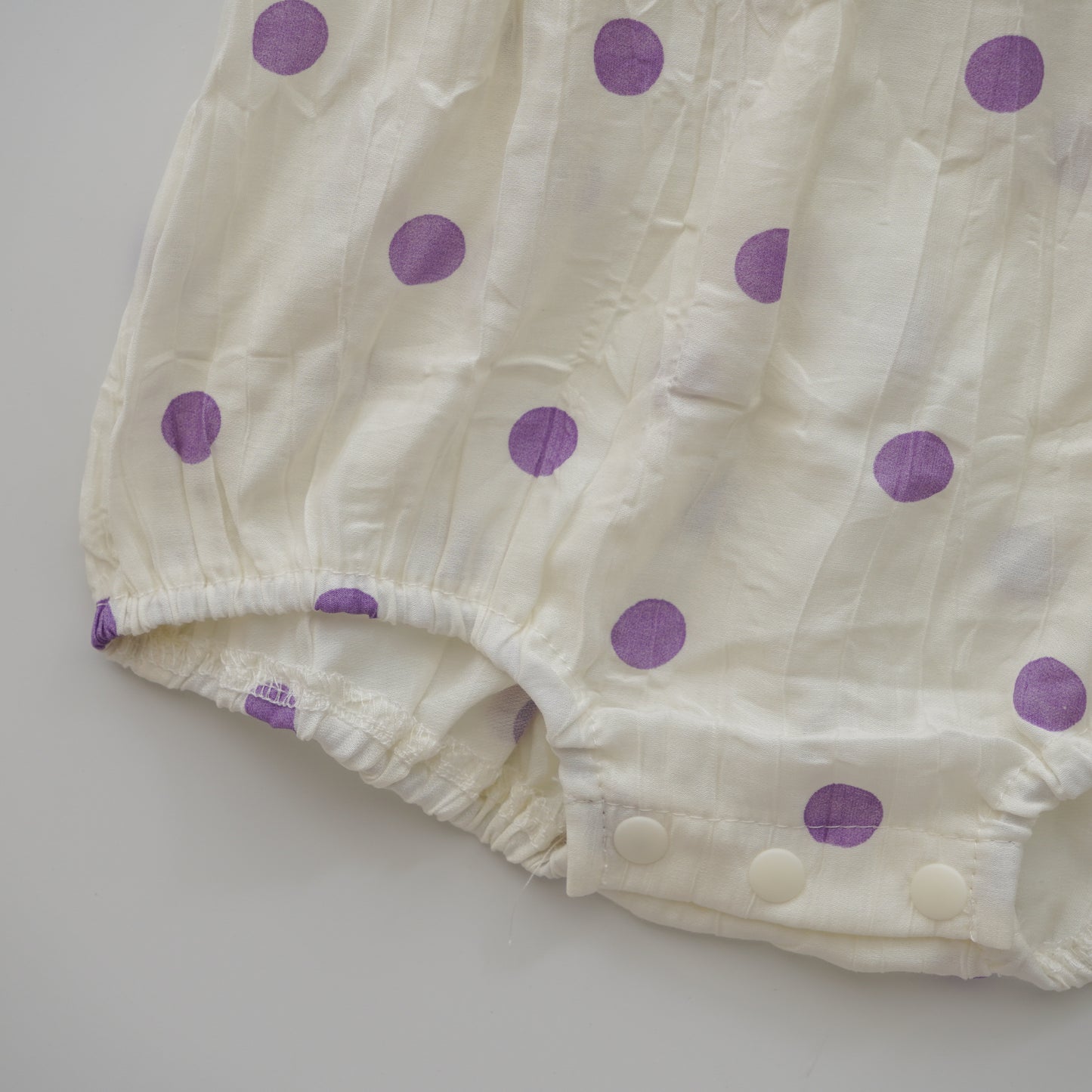 Polka Dot Ribbon Romper in Purple
