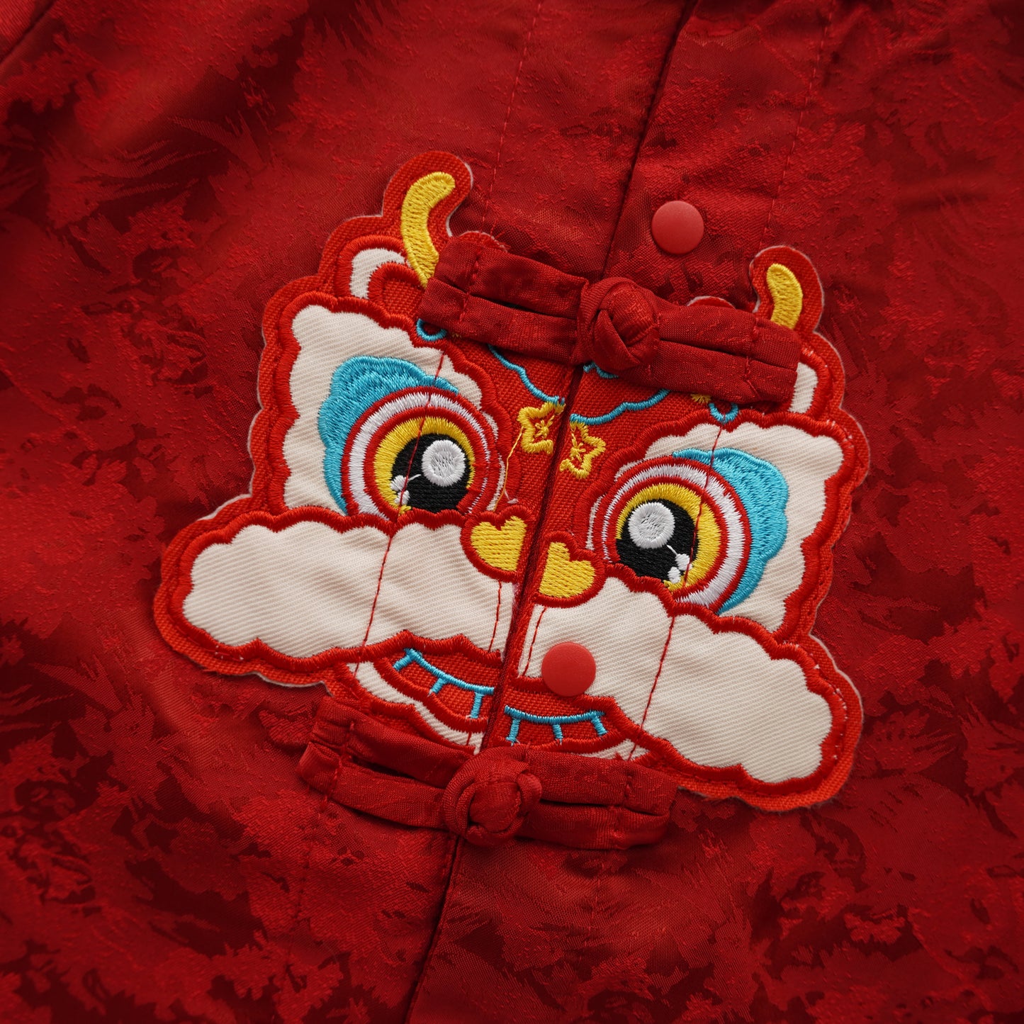 Lion Buttoned Chinese Romper